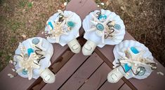 three seashells are sitting on top of a bench