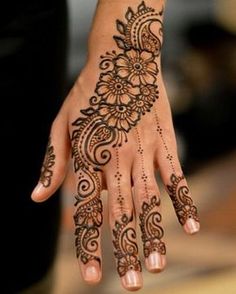 henna tattoo on the palm of a woman's hand