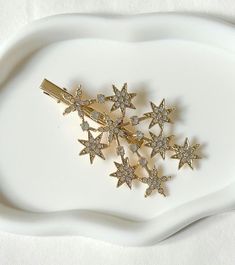 Add a touch of elegance to your hairdo with this stunning crocodile hair clip. The sparkling gold star crystal patterns makes it a perfect accessory for any occasion, especially weddings.  Made from high quality metal and features a sparkling gold finish, making it a great addition to any bridal or bridesmaid outfit. Ship with Royal Mail service. Express delivery available at checkout. Thank you for visiting my shop Allbeautifulbybren Wedding Barrettes, Star Crystal, Alligator Hair Clip, Crystal Pattern, Bridesmaid Outfit, Gold Star, Girls Hair, Girls Hair Accessories, Gold Stars