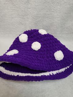 I usually sell these hats at events. However, many people have requested I sell them online as well so here we are! now you and your fellow fungi can get your mushroom on These hats are knit tightly but they do stretch if you need. In otherwords, one size fits all! Crochet Mushroom Hat, Rave Hats, Purple Mushroom, Mushroom Hat, Crochet Mushroom, Festival Hat, Christmas Deals, Bucket Hats, Dark Purple