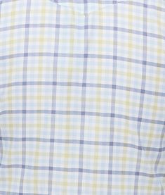 a man wearing a blue and yellow checkered shirt