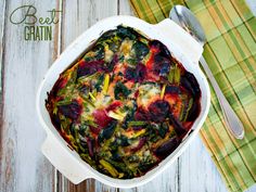 a casserole dish filled with vegetables on top of a green and yellow napkin