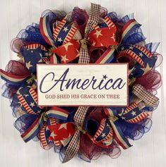 a patriotic wreath that says america god shed his grace on thee