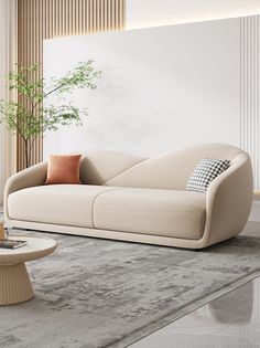 a living room with a couch, coffee table and potted plant