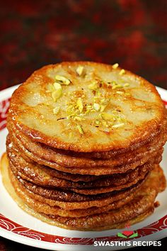 stack of desert pancakes on a red and white plate with text overlay that reads, malpua dessert pancakes