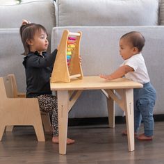 Siblings sharing a table and chair set Montessori Weaning Table, Weaning Table, Stages Of Growth, Natural Chair, Toddler Table And Chairs, Toddler Table, Feature Chair, Table And Chair Set, Table Leg