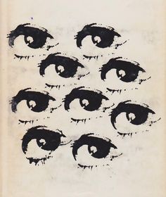 an old book with eyes drawn on it