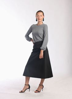 "Be right on clean minimal look with Aline midi skirt in timeless simplicity Black cotton skirt sits a little high on waist making your silhouette long and lean Midi length is super chic for this season Pair with simple top and heels or knee high boots to keep style minimal and polished Or wear as a chic casual skirt paired with snickers or athletic shoes -Tailored fit -Waist sits around naval -Side hidden zipper -Made of soft feel medium weighted cotton fabric with hint of stretch -Finishing is Aline Midi Skirt, Black Cotton Skirt, Black Ruffle Skirt, Timeless Simplicity, Skirt Office, Tango Skirt, Mid Length Skirt, Office Suit, San Ramon