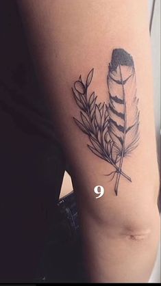 a woman's thigh with a feather and arrow tattoo on her left side ribcage