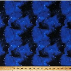 a blue and black background with stars in the sky, as well as a ruler