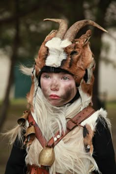 a woman wearing a horned headdress with horns