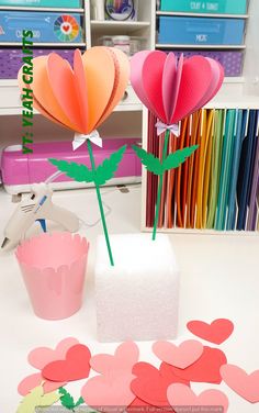 some paper flowers are sitting on a table