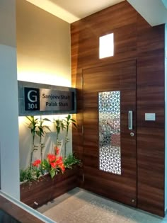 the entrance to an office building with wooden doors