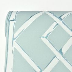 a blue and white pillow with an abstract design