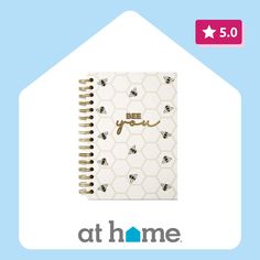 a spiral notebook with the words bee you written on it and honeycombs in gold foil