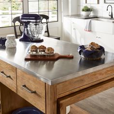 Gorgeous and reclaimed look carbonized pine makes up this smart iNSPIRE Q kitchen island by iNSPIRE Q Classic. Slide-out the leaf extension from the hidden pocket to create additional surface space then push it back in to open up your room. Select your choice of easy-to-clean stainless steel, classic reclaimed look carbonized pine, or industrial concrete veneer for the tabletop of your new, space-conscious kitchen island. Features: Overall dimensions when fully extended: 99.5 in. width x 36 in. Stainless Steel Island Kitchen, Steel Island Kitchen, Extendable Kitchen Island, Steel Kitchen Island, Kitchen Island Features, Airbnb Kitchen, Stainless Steel Kitchen Island, Stainless Steel Island, Kitchen Island Tops