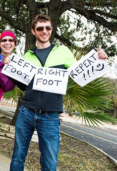 two people holding signs that say left right feet, foot foot