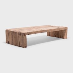 a wooden bench made out of logs