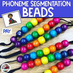 some colorful beads are on a table with the words phone segmnation beads written in it