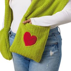 You'll be wearing a Grinchy grin whenever you enjoy winter activities in this handy hooded scarf. Cozy green scarf features a Grinch face embroidered on the hood and includes two large pockets on the ends of the scarf for warming your hands or carrying necessities. A red heart-shaped appliqué on one of the two pockets adds heartwarming charm to the soft fleece scarf. It makes a fun gift for a teacher, college kid or Grinch fan. Green Grinch hooded scarf features embroidered and appliqué accents Hooded Scarf With Pockets, Harry Potter Pets, Scarf With Pockets, Grinch Who Stole Christmas, Grinch Face, The Grinch Stole Christmas, Travel Tools, Enjoy Winter, Fleece Scarf