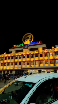 a car parked in front of a hotel at night