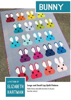 a quilt with many different colored bunnies on it