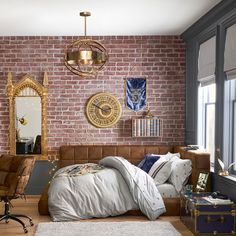 a bedroom with brick walls and wooden floors