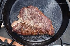 a steak is cooking in a skillet on the stove