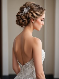 a woman wearing a wedding dress with a hair comb in her hair