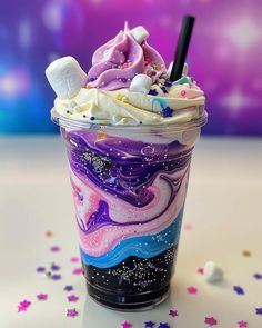 an ice cream sundae with marshmallows and unicorn topping