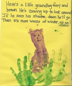 a child's handprint on a yellow paper with a bear in the middle