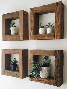 two wooden square shelves with plants in them