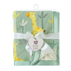 a baby blanket with a giraffe on it