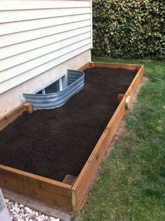 an image of a backyard with a raised garden bed