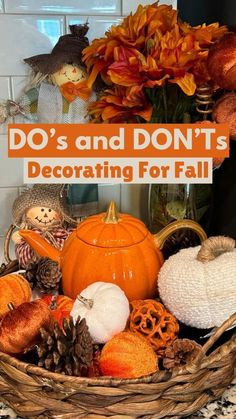 a basket filled with pumpkins and other decorations