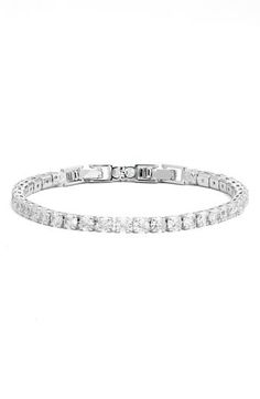 Prong-set round cubic zirconia illuminate a sparkly tennis bracelet that's perfect to stack or wear solo. 7" length; 2" extender; 1/8" width Fold-over clasp 14k-gold layer or platinum layer/cubic zirconia Imported Tennis Bracelet, Womens Jewelry Bracelets, Prong Setting, Cubic Zirconia, Tennis, Silver Tone, Gold Tones, Nordstrom, Women Jewelry