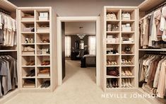 a walk in closet filled with lots of clothes and shoes on shelves next to a bed