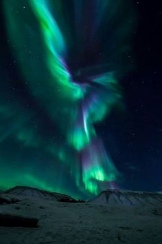 an aurora bore is seen in the night sky