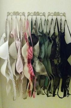 there are many bras hanging on the wall