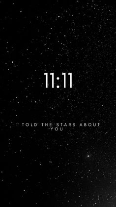 the words 11 11 are written in white on a black background with stars above it