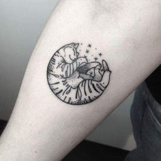 a black and white photo of a person's arm with a clock on it