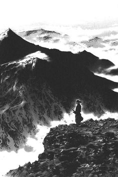 a person standing on top of a mountain with an umbrella over their head and clouds in the background