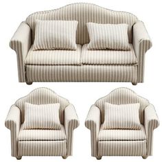 a set of three chairs with pillows on them