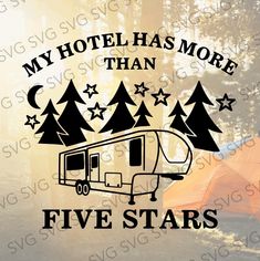 a camper is parked in the woods with trees and stars on it's decal