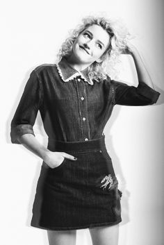 black and white photograph of woman in denim dress