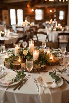 the table is set with candles and place settings