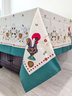 the table cloths are decorated with an image of a rooster