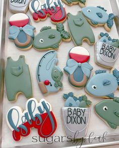 baby shower cookies are arranged on a tray