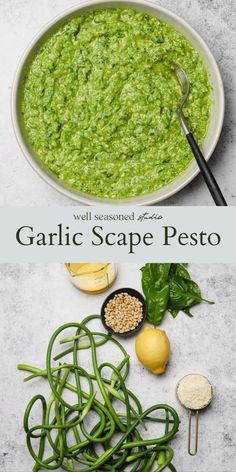 garlic scape pesto in a white bowl with green beans and lemons on the side