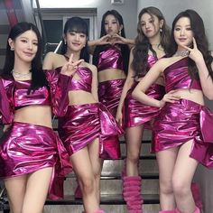 the girls are wearing shiny pink outfits